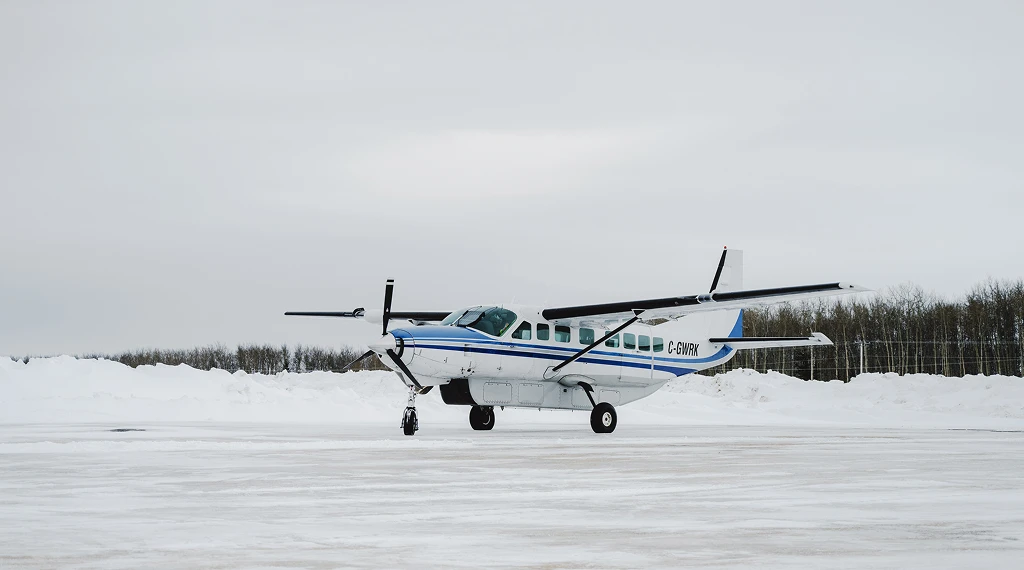 Single engine aircraft on snowy runway