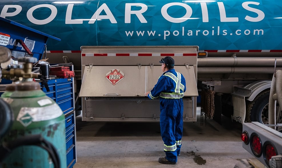 Worker near Polar Oils truck