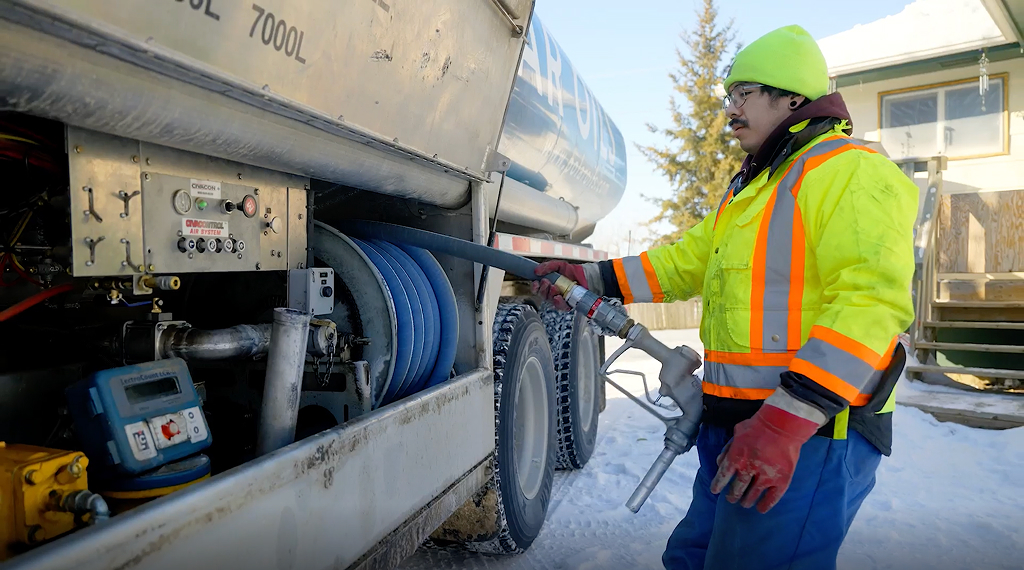 Man fueling truck in winter setting