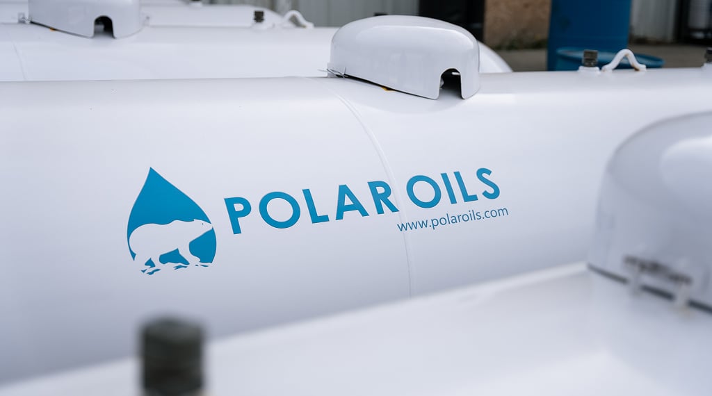 White oil tanks with logo displayed