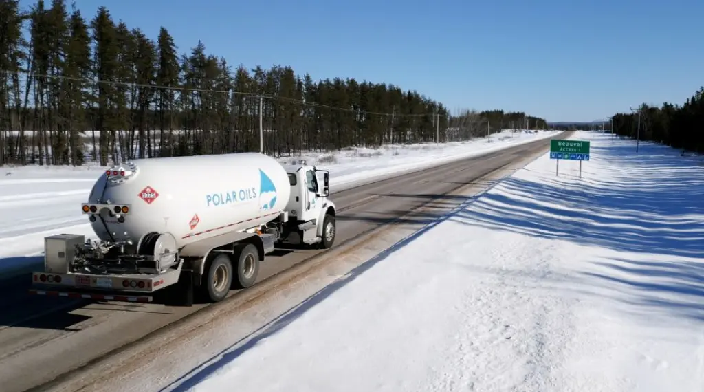 Truck transporting propane on snowy road