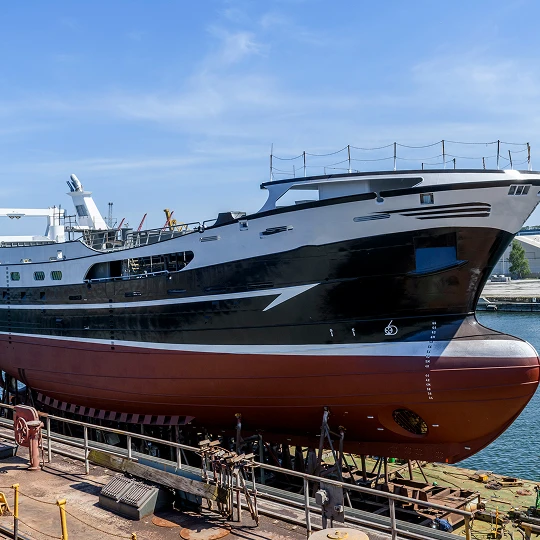Large ship docked for maintenance.
