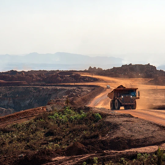Large truck on dusty mining road
