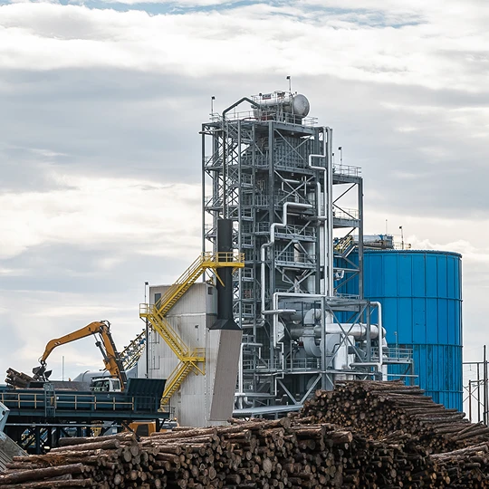 Industrial facility with logs and machinery