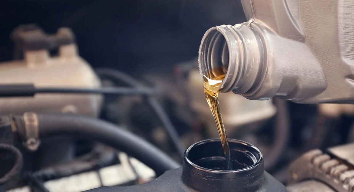 Pouring oil into an engine
